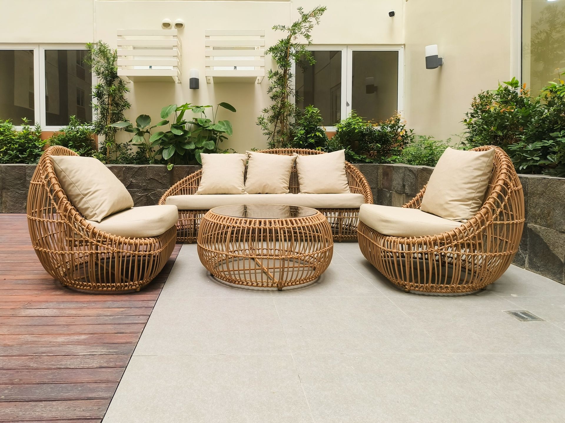 PE rattan sofa set with cream cushions on aluminum frame